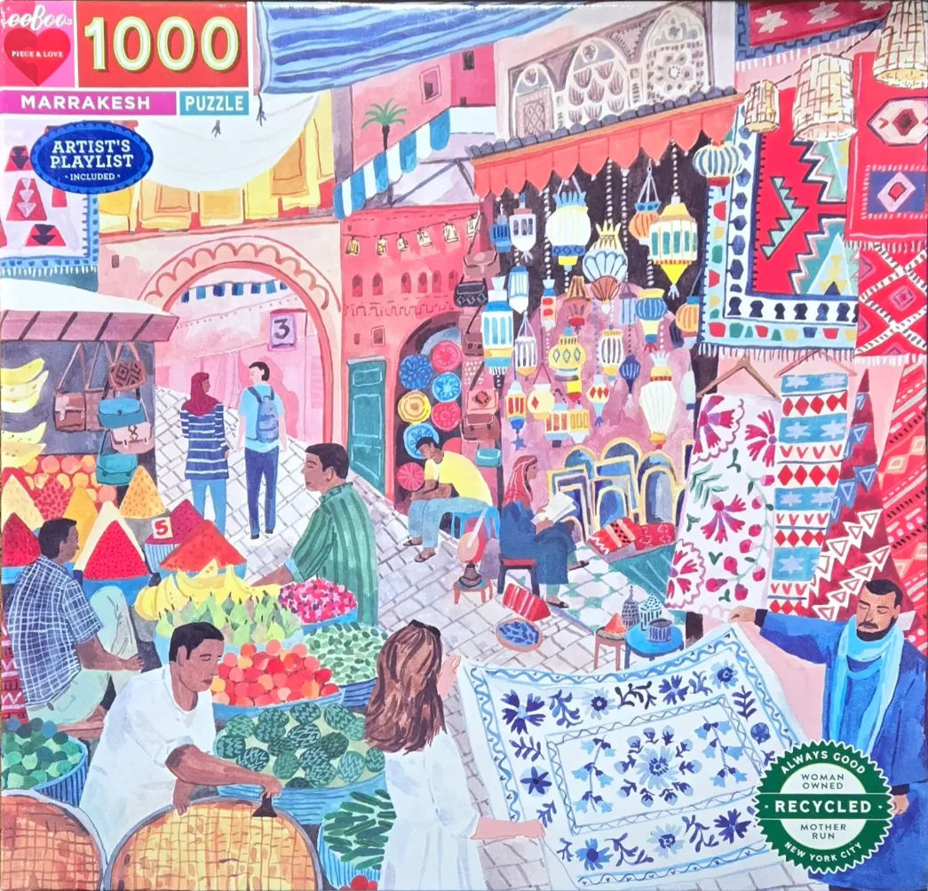 An illustration of a bustling Marrakesh market scene with colorful rugs, lanterns, and produce stalls.