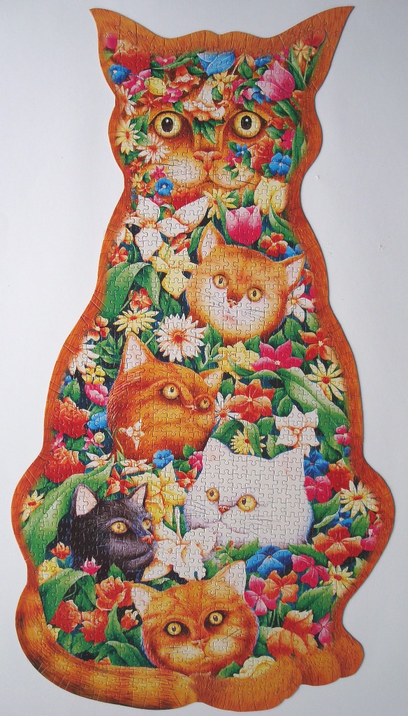 A shaped illustration of several cats nestled among vibrant garden flowers, forming a large cat silhouette.