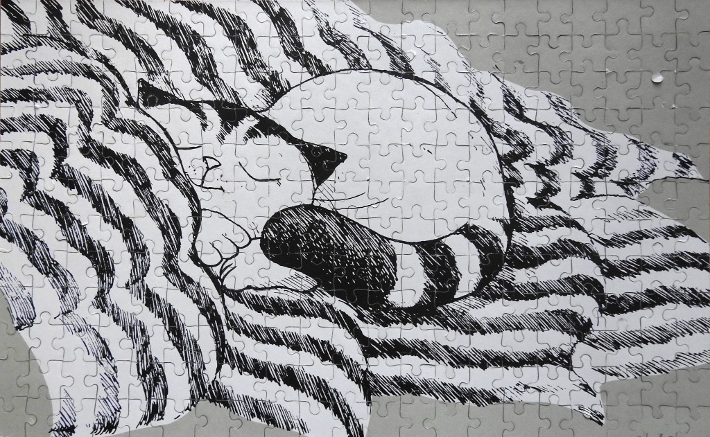 A black and white line drawing of a cat curled up asleep on a striped blanket.