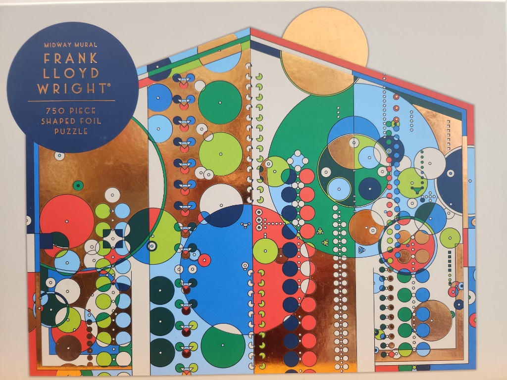 An abstract geometric mural by Frank Lloyd Wright featuring circles, lines, and metallic foil accents.