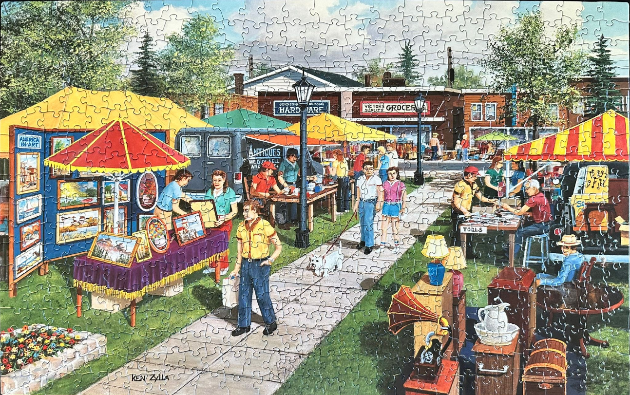 An outdoor street market or antique fair scene in a small town with various vendor stalls and shoppers.