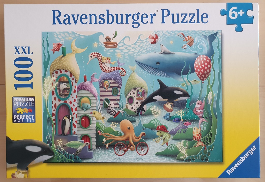 Whimsical underwater scene featuring colorful fish-shaped houses, marine animals, and sea creatures in a vibrant style.