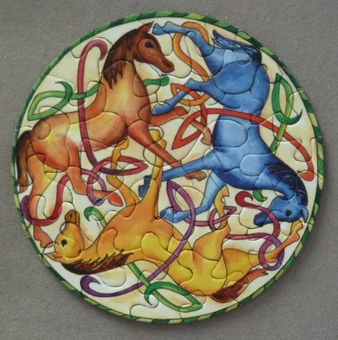 A circular illustration of three horses in red, blue, and yellow prancing among intertwined Celtic knotwork ribbons.