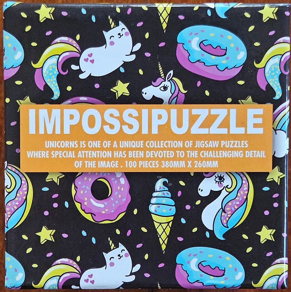 A black background featuring a repeating pattern of unicorns, cats with unicorn horns, donuts, and ice cream cones.