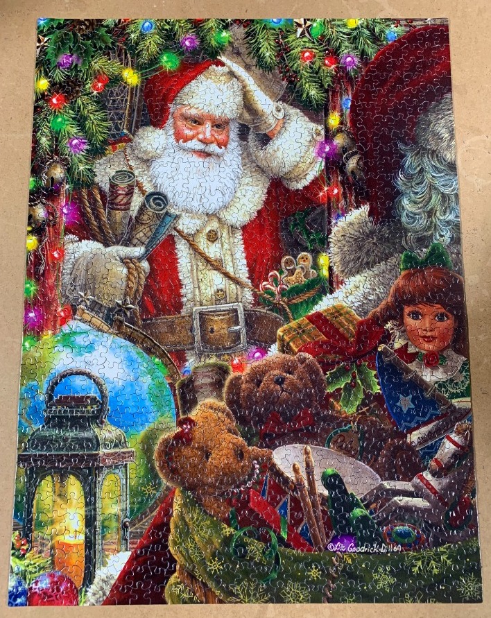 Santa Claus surrounded by toys, gifts, and Christmas decorations