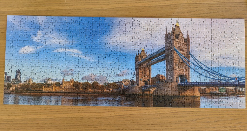 Panoramic photograph of London's Tower Bridge at sunset.