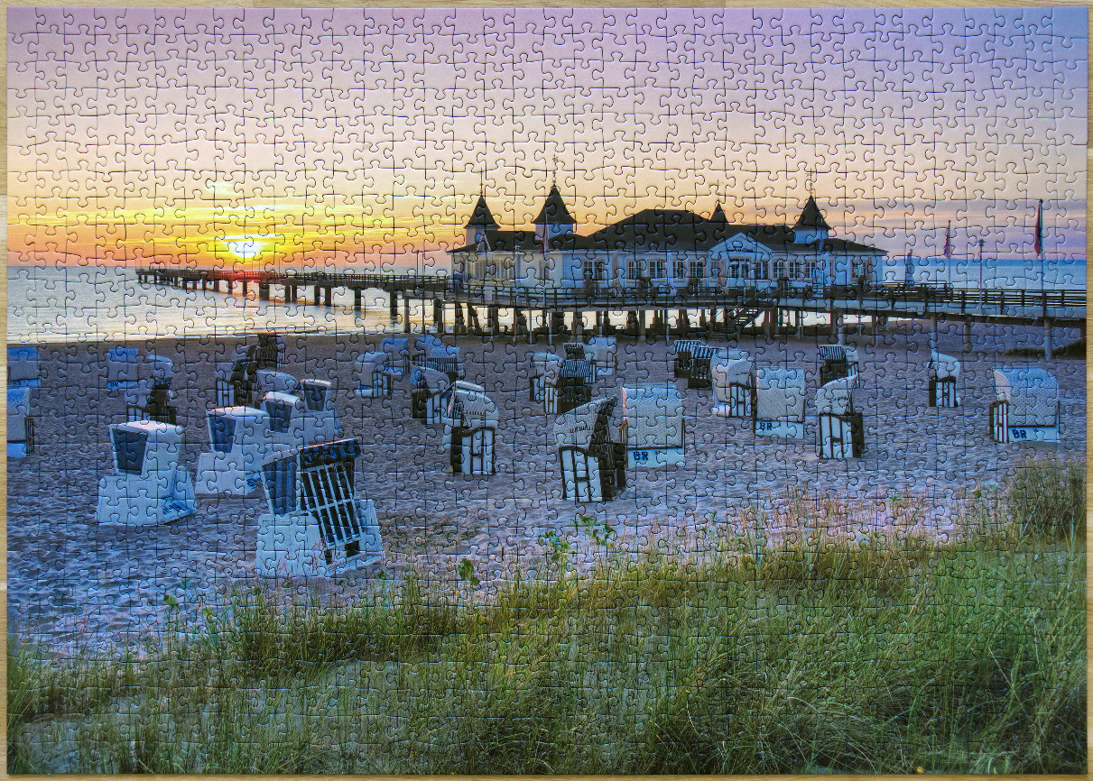 Sunset view of the Sellin Pier and beach chairs on the island of Rügen, Germany.