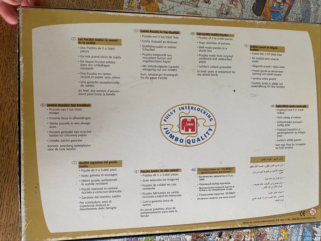 Information board regarding product quality standards and features written in multiple languages.