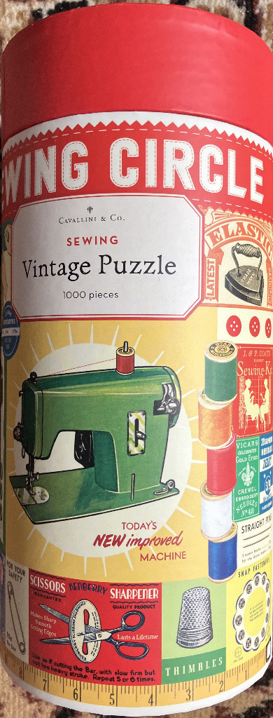 Vintage sewing themed collage with a green sewing machine and colorful thread spools in a retro graphic style.