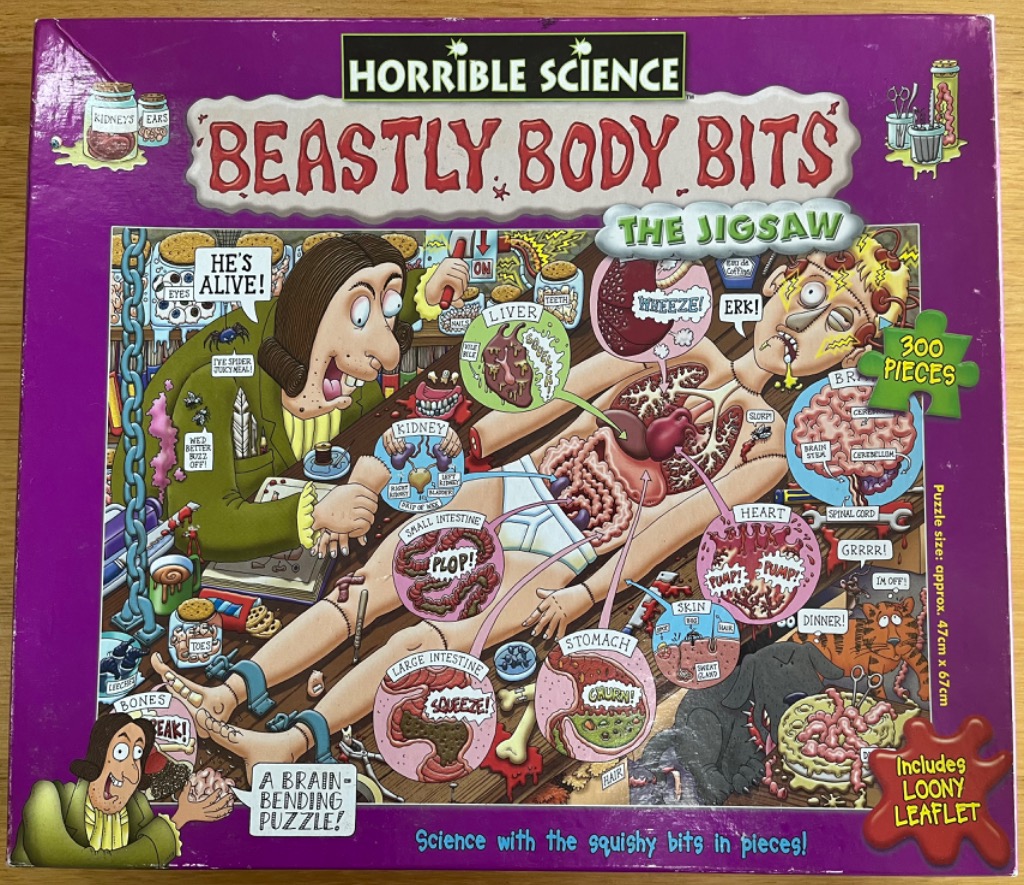 Cartoon illustration of a mad scientist performing surgery on a body with labeled organs and body parts.