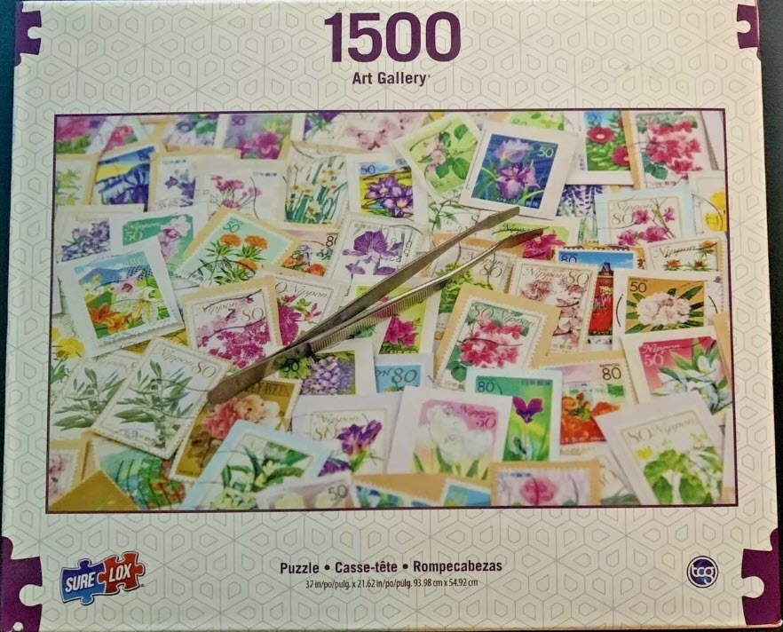 A collection of Japanese floral postage stamps scattered with a pair of metal tweezers resting on top.