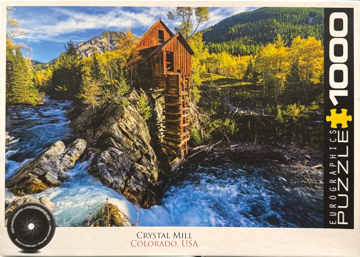 A rustic wooden mill perched on a rocky cliff above a rushing river in a golden autumn forest.