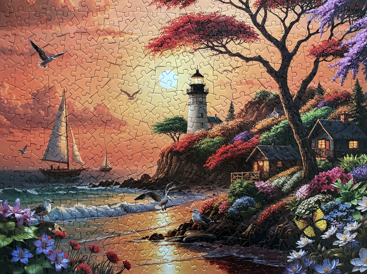 A peaceful coastal lighthouse scene at sunset with sailboats, flowers, and a cottage.