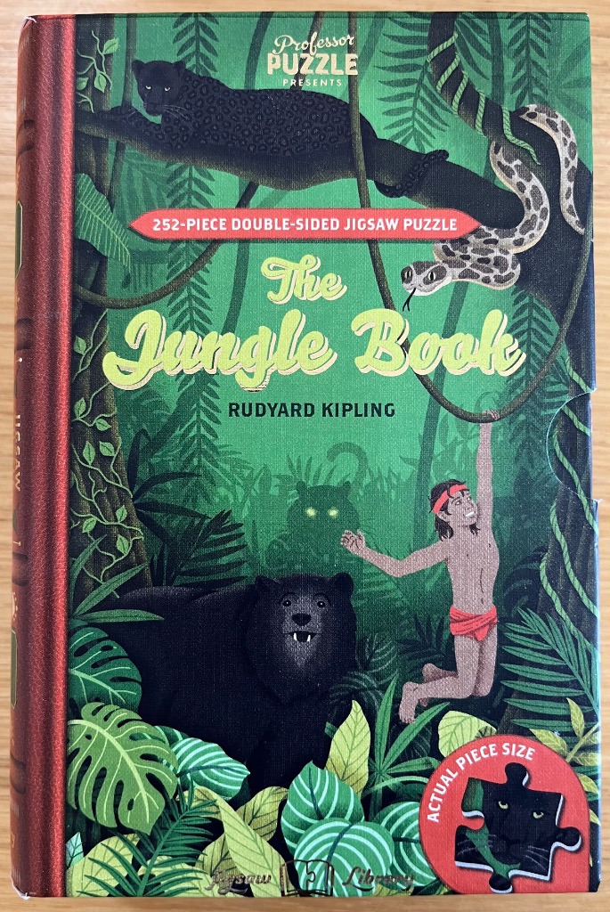 Illustration of Mowgli, a panther, a bear, and a snake in a lush green jungle scene.
