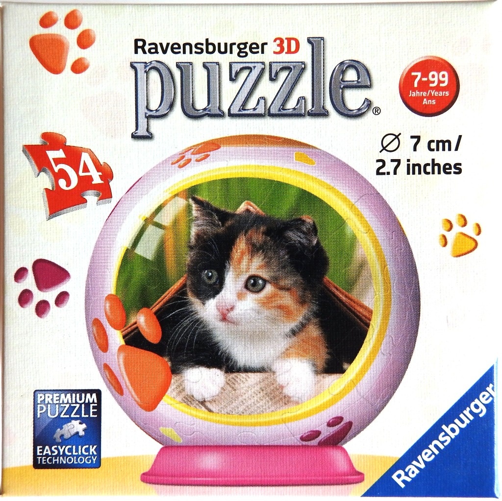 A spherical, calico kitten-themed object with paw print decorations.