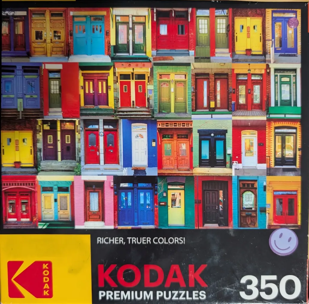 A collage of 30 colourful front doors of various architectural styles arranged in a grid.