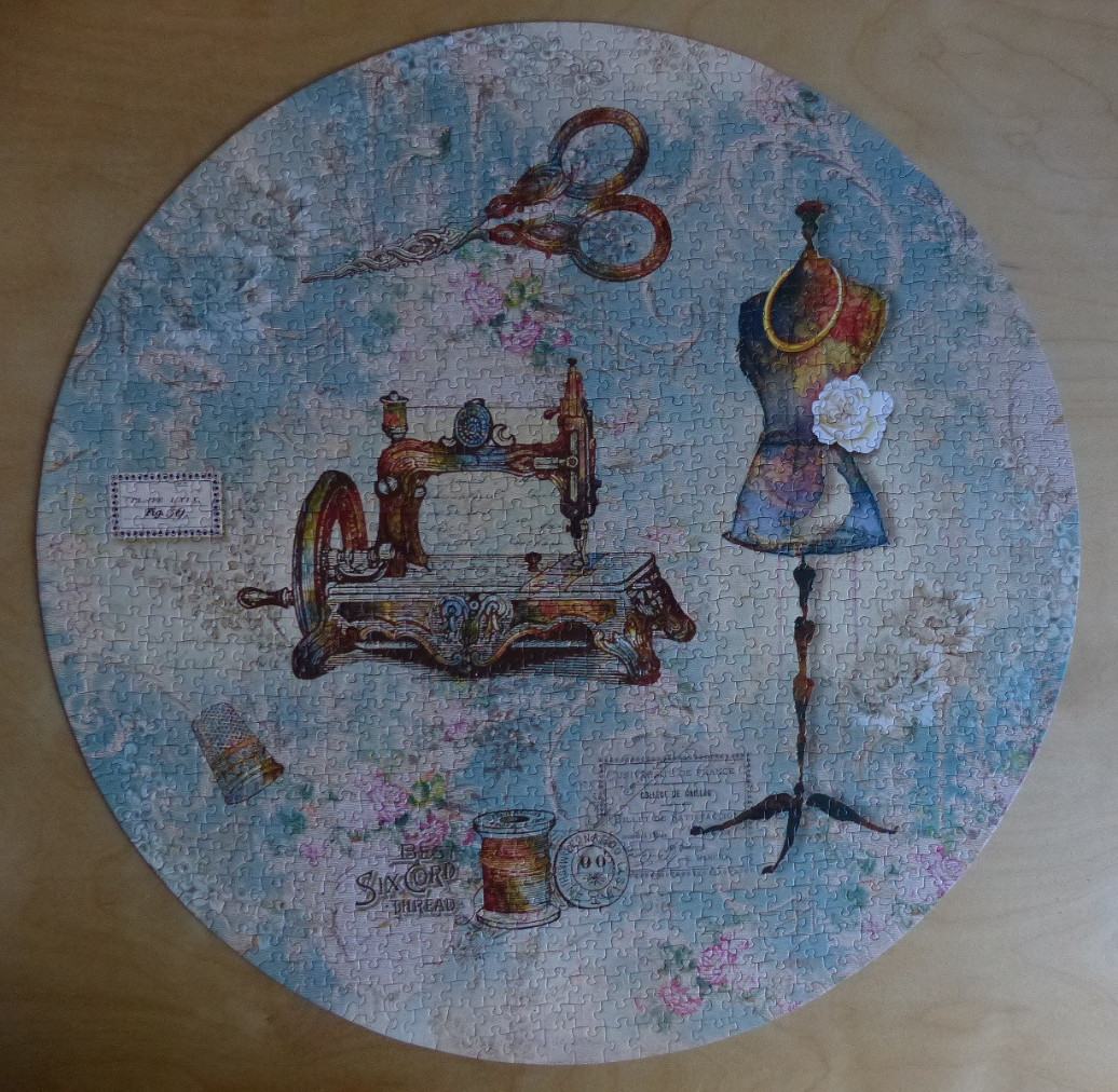Circular collage of vintage sewing items including a sewing machine, mannequin, scissors, and thread against floral wallpaper