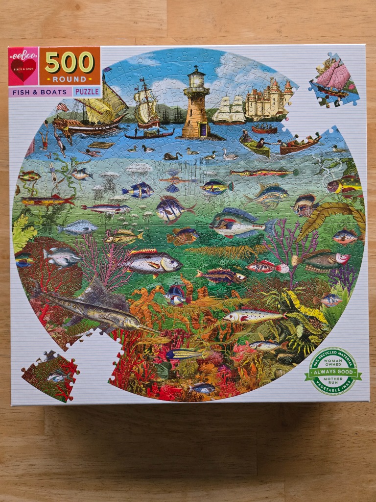 Illustration of a circular underwater scene featuring fish, ships, and a lighthouse