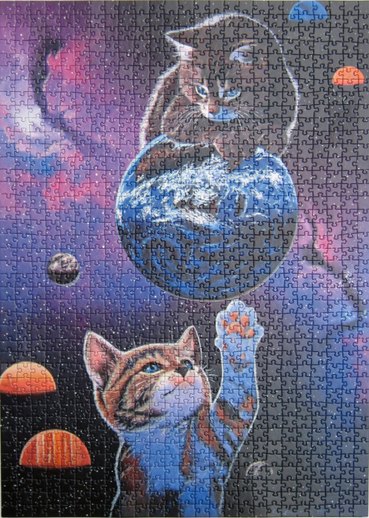 Two tabby cats in outer space, one perched on planet Earth and one reaching up to touch it.