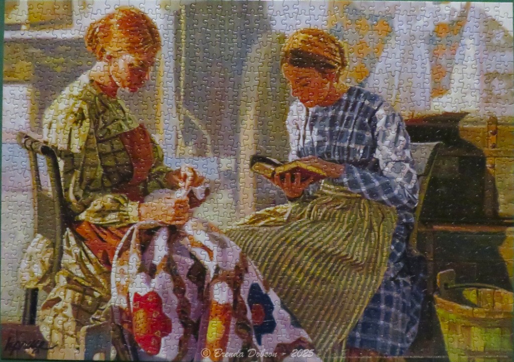 Two women in colonial-style clothing sitting and working, one quilting and one reading.