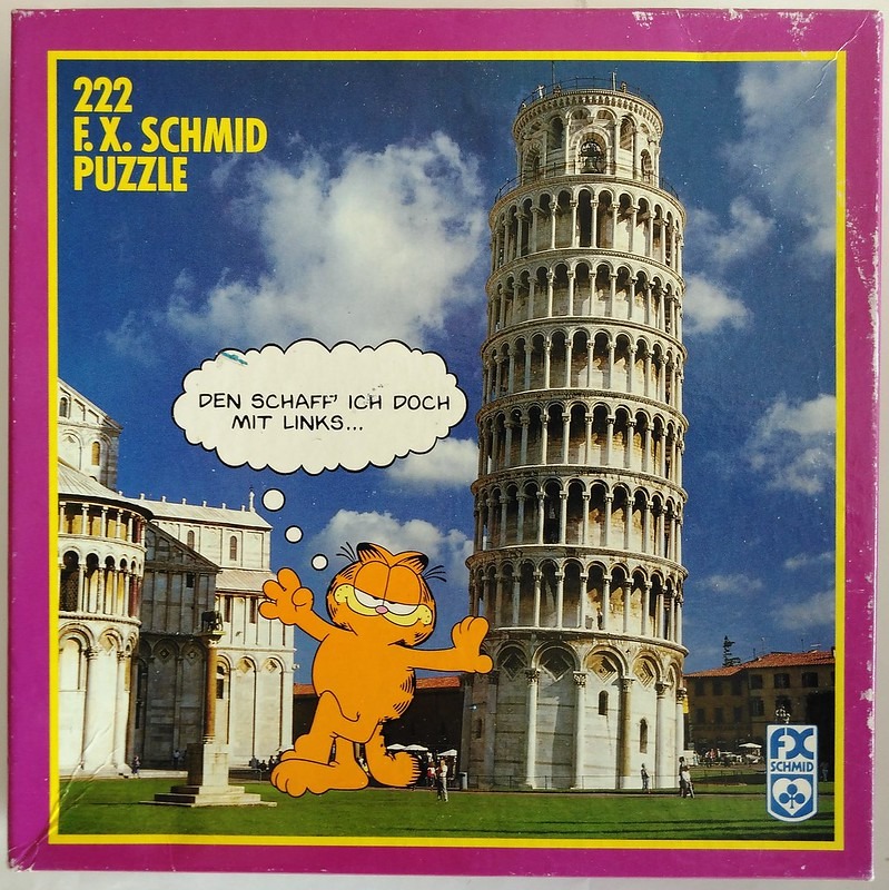 Cartoon character Garfield standing in front of the Leaning Tower of Pisa with a German speech bubble.