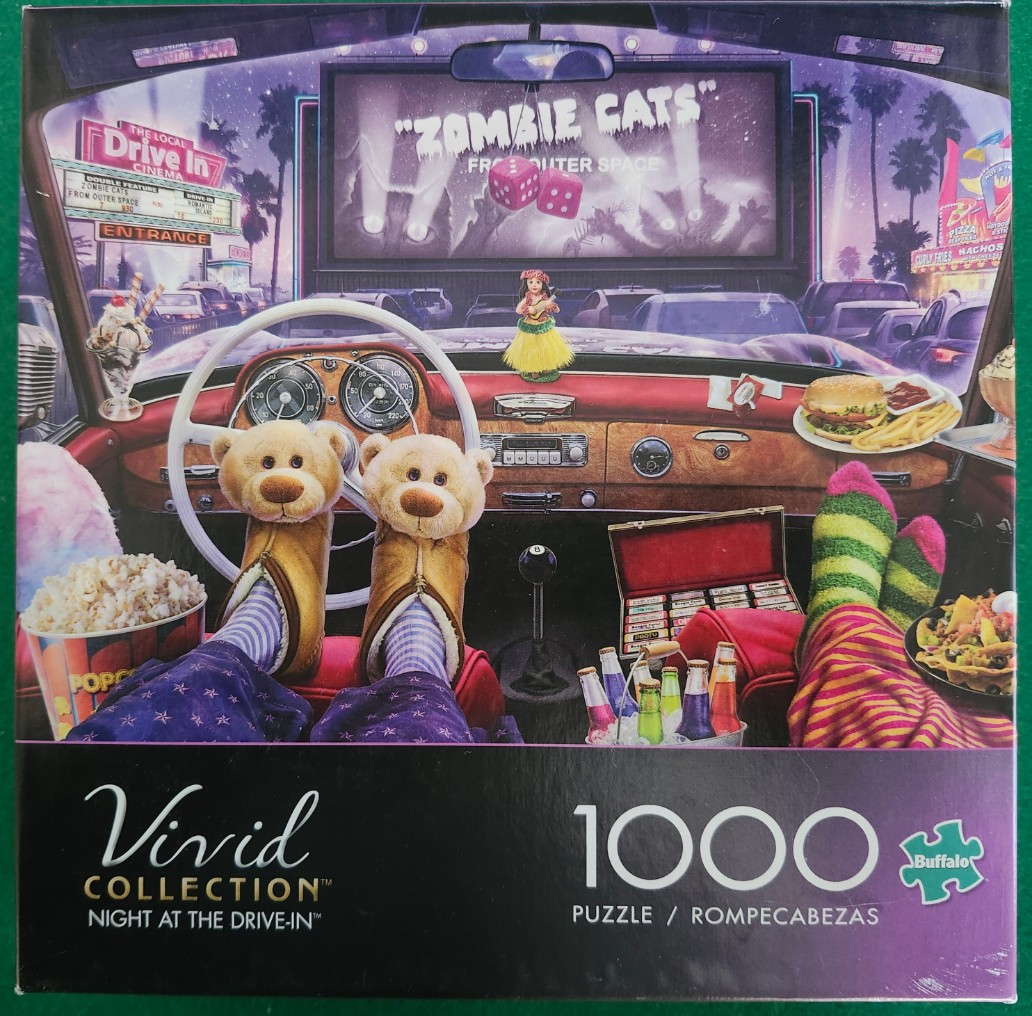 View from inside a car at a drive-in movie featuring teddy bear slippers and snacks.