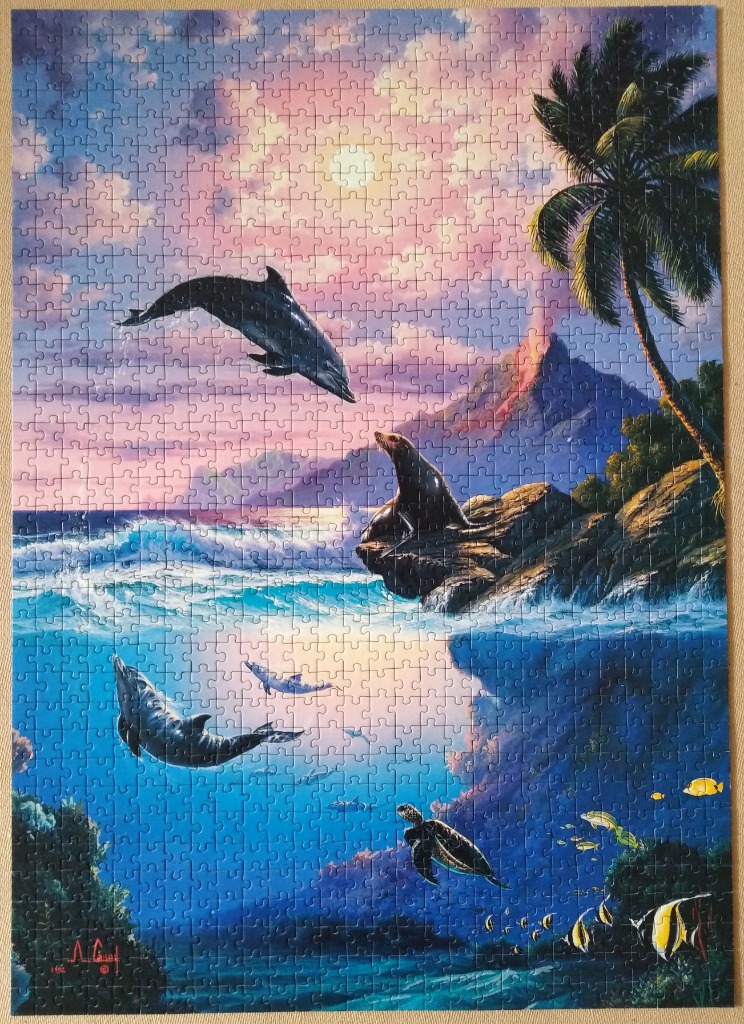 Tropical coastal scene at sunset with dolphins, a sea lion, and a sea turtle.