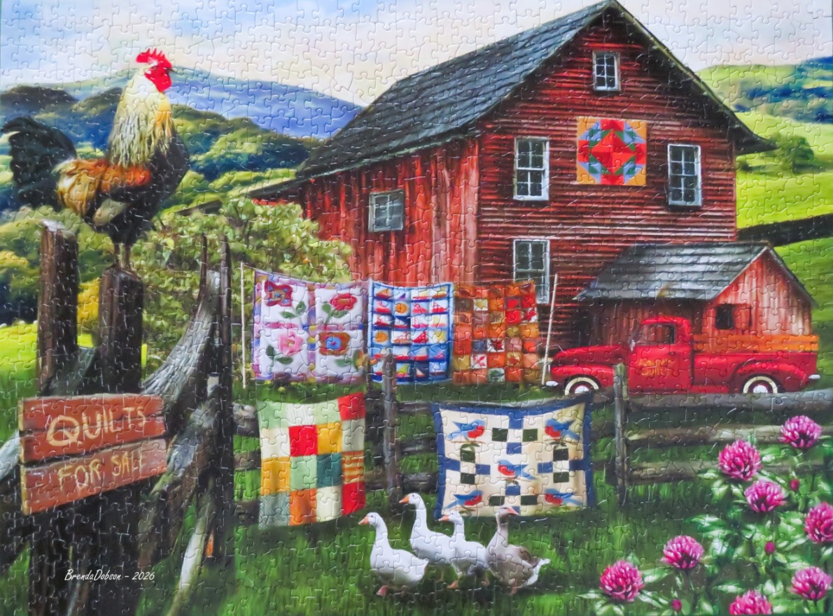 A pastoral scene with a rooster, a red barn with quilts on a clothesline, and a vintage red truck.