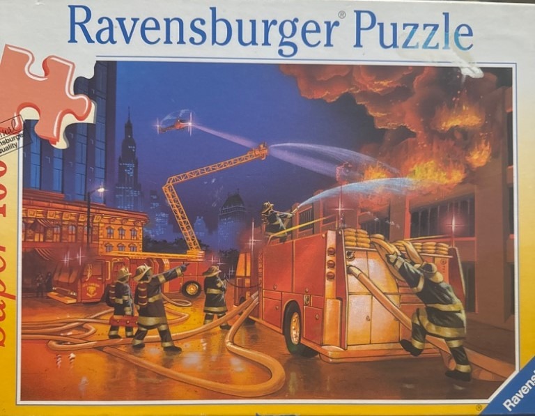 An illustration of firefighters battling a building fire at night with fire trucks and water hoses.
