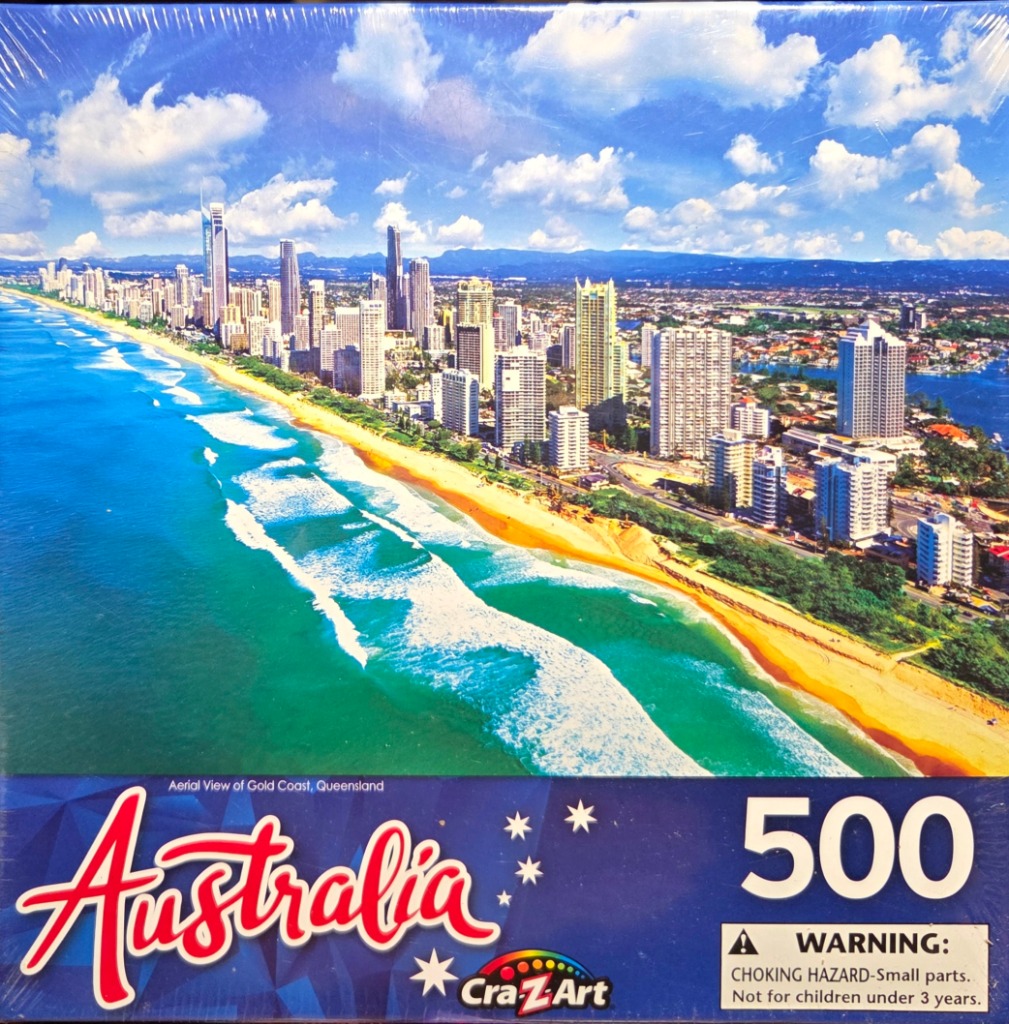 Aerial view of the Gold Coast skyline and beach in Queensland, Australia under a blue sky.