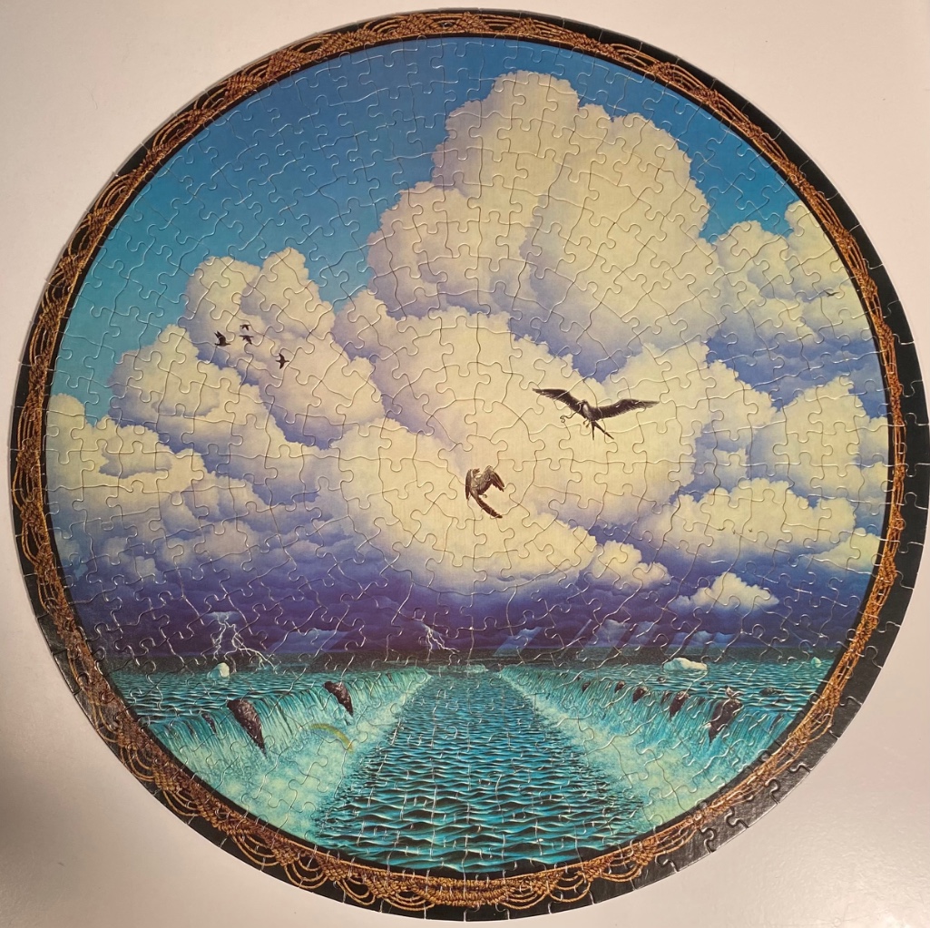 A circular illustration of a stormy sea with dolphins leaping toward a bright opening in the clouds.