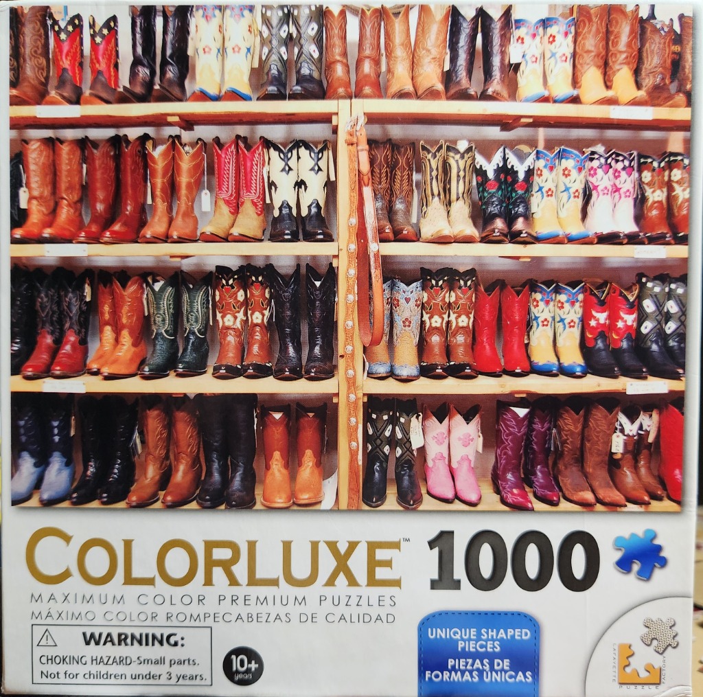 Rows of colorful cowboy boots on wooden shelves