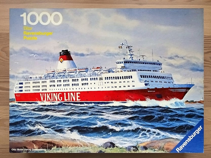 A painting of a Viking Line passenger ferry ship navigating through choppy, dark blue sea water.