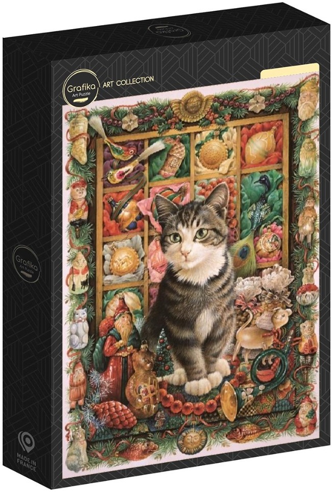 A tabby cat sits in front of a window display filled with vintage Christmas ornaments and holiday decorations.