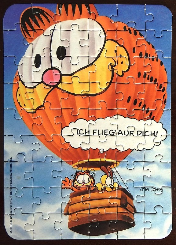 Garfield and Odie in a hot air balloon shaped like Garfield