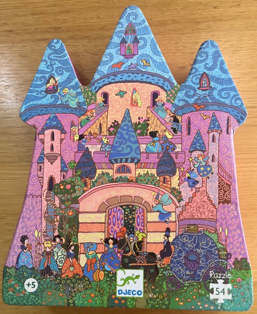 Illustrated fairy tale castle scene with princesses, fairies, and a horse-drawn carriage in vibrant colors.