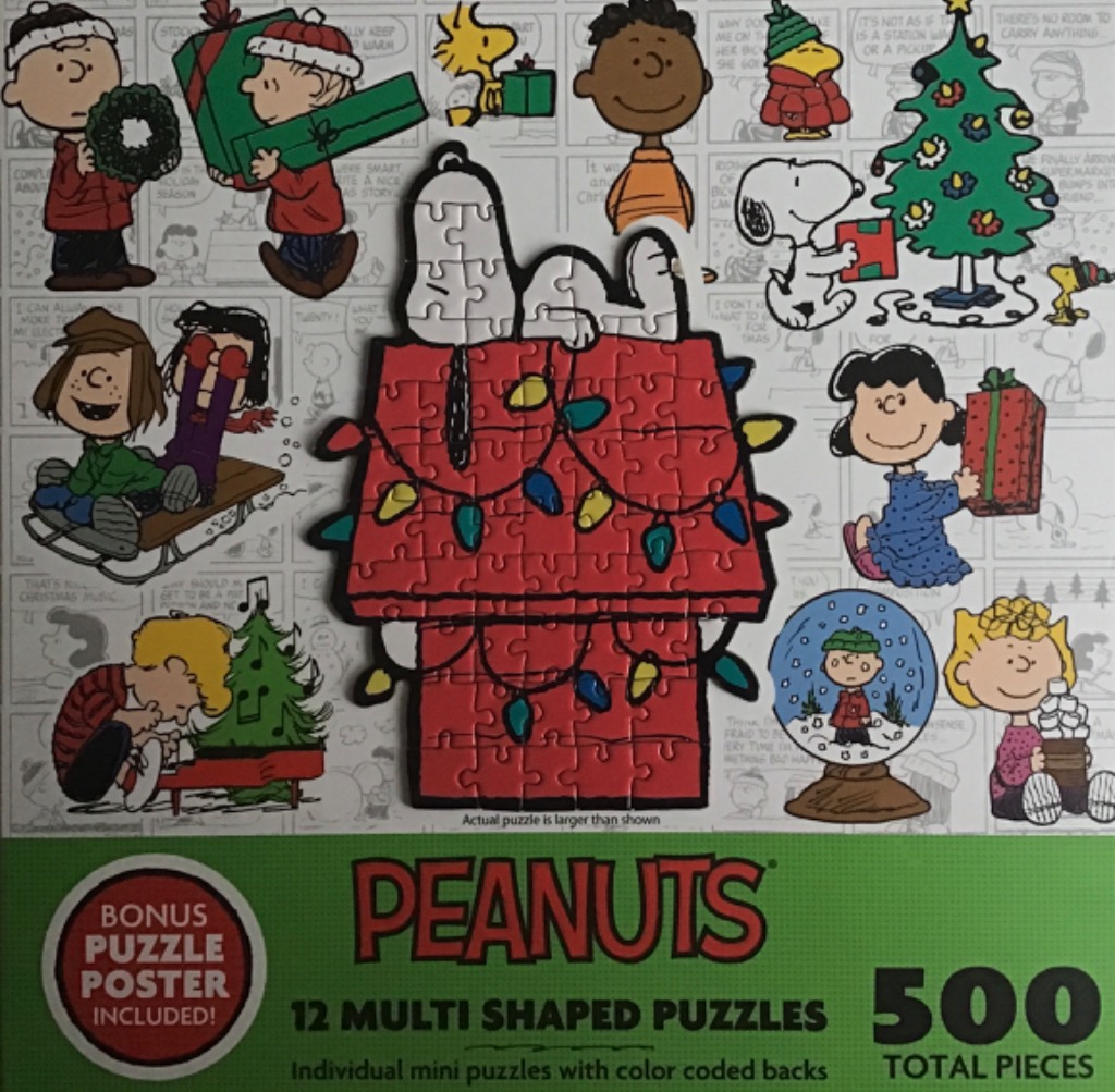 A collage of Peanuts characters celebrating Christmas with a central die-cut puzzle of Snoopy on his doghouse.