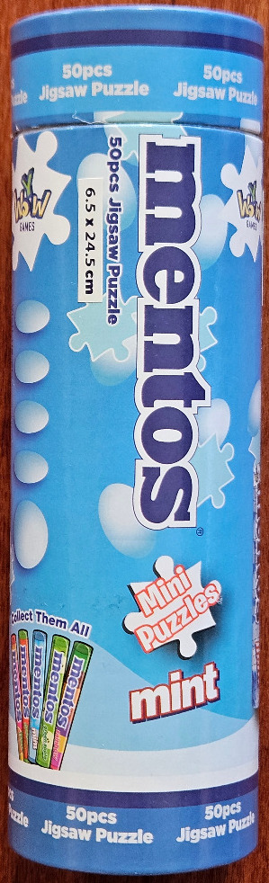 A cylindrical packaging tube featuring the Mentos Mint logo and branding.
