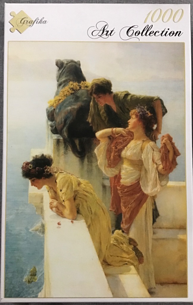 Three women in classical-style robes stand on a stone terrace overlooking a sea with a large stone sphinx sculpture.