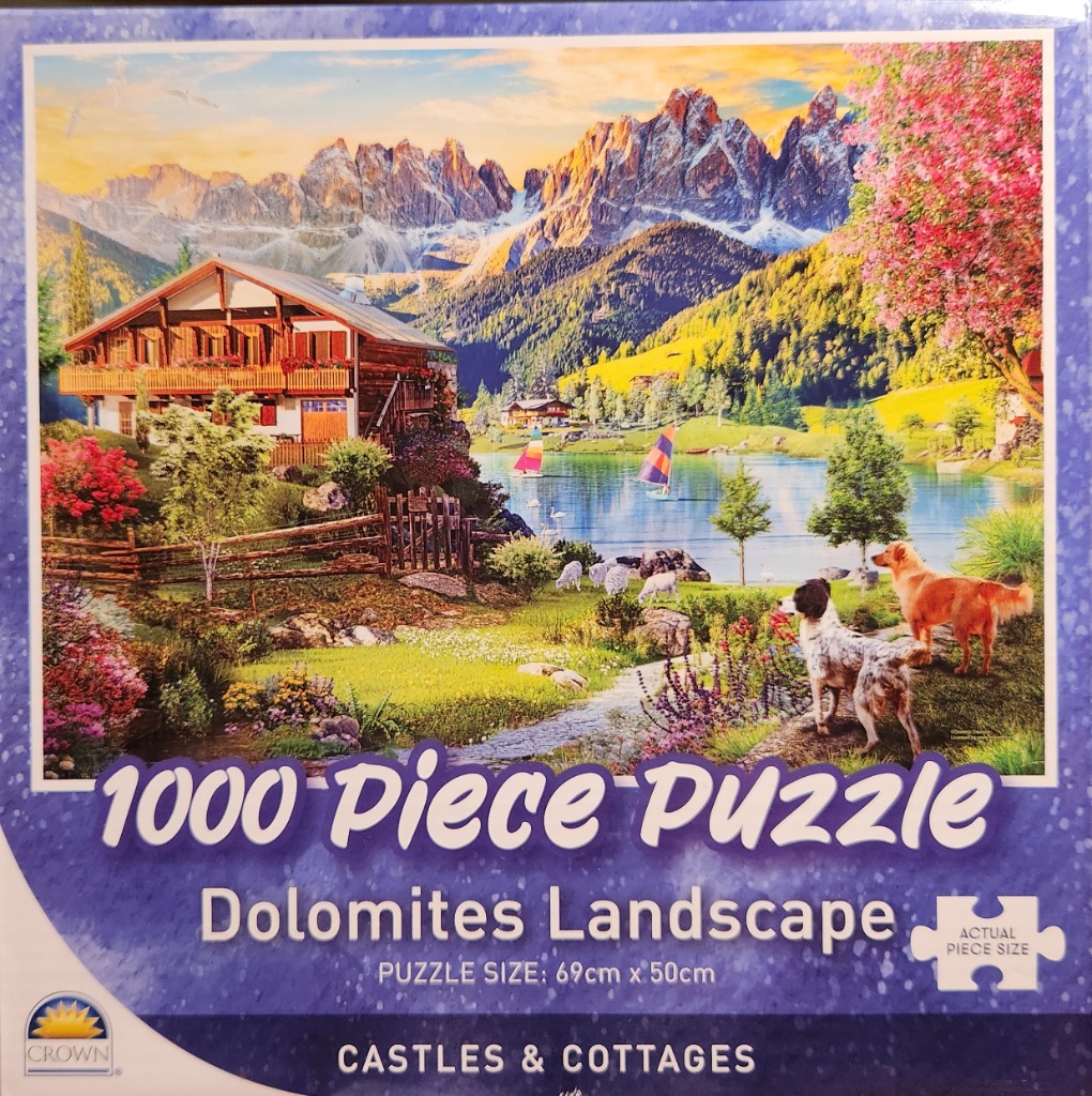 A scenic landscape of a wooden mountain chalet by a lake in the Dolomites with dogs in the foreground.
