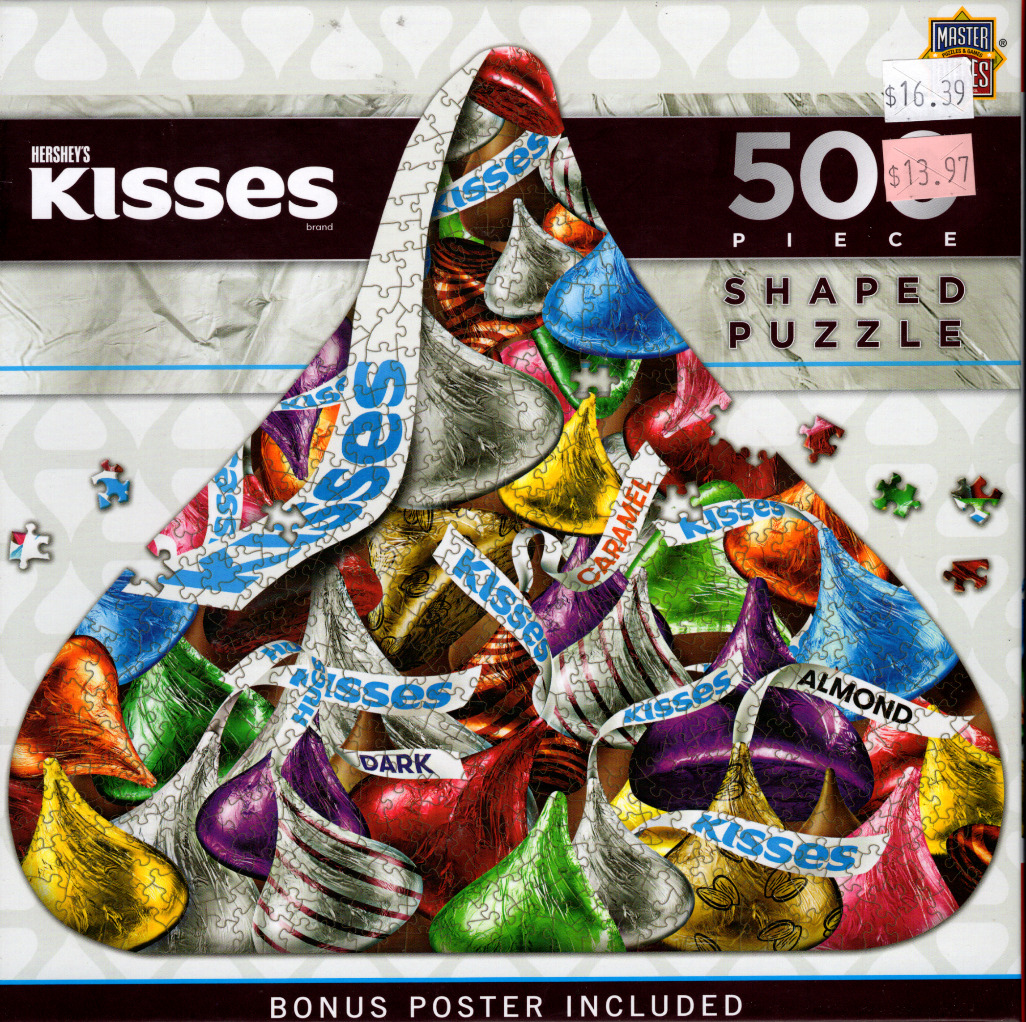 A collage of colourful foil-wrapped chocolate candies arranged into the shape of a single large chocolate kiss.