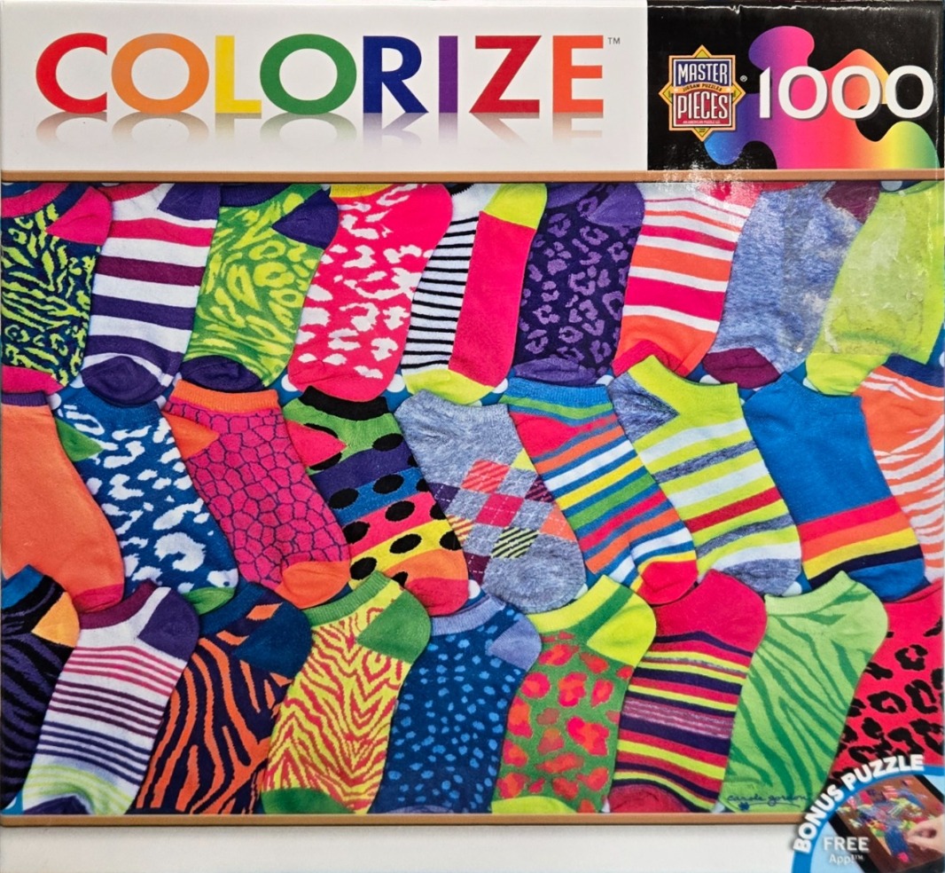 A dense, colorful pattern of various patterned and striped ankle socks arranged in an overlapping grid.