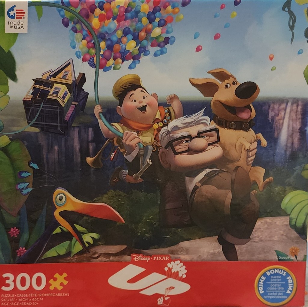 Animated scene with Carl, Russell, a golden retriever, and a colorful balloon-lifted house floating above a jungle.