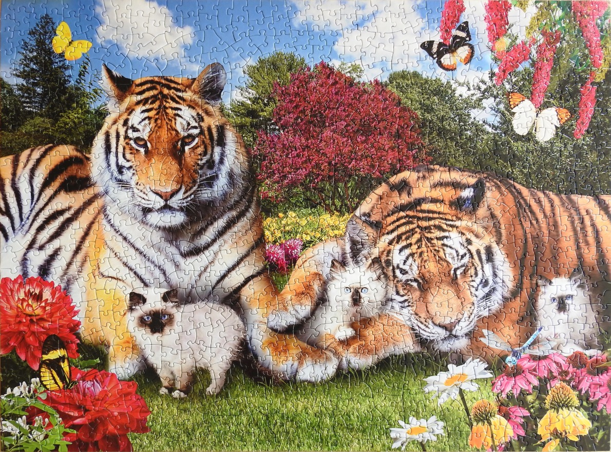 Two tigers resting in a lush garden with three fluffy kittens, butterflies, and vibrant flowers.