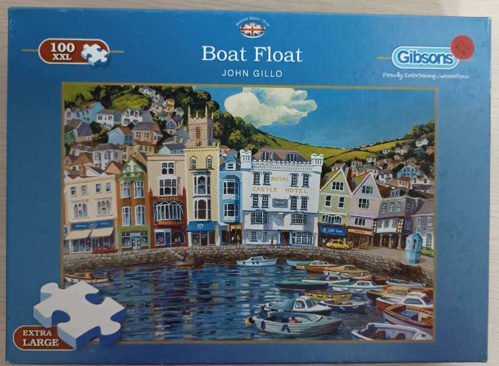 An oil painting of a coastal town harbor filled with small boats sitting in front of colorful waterfront buildings.