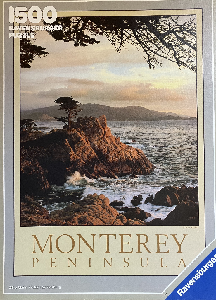 A scenic photograph of the Lone Cypress on a rocky coastline at sunset.