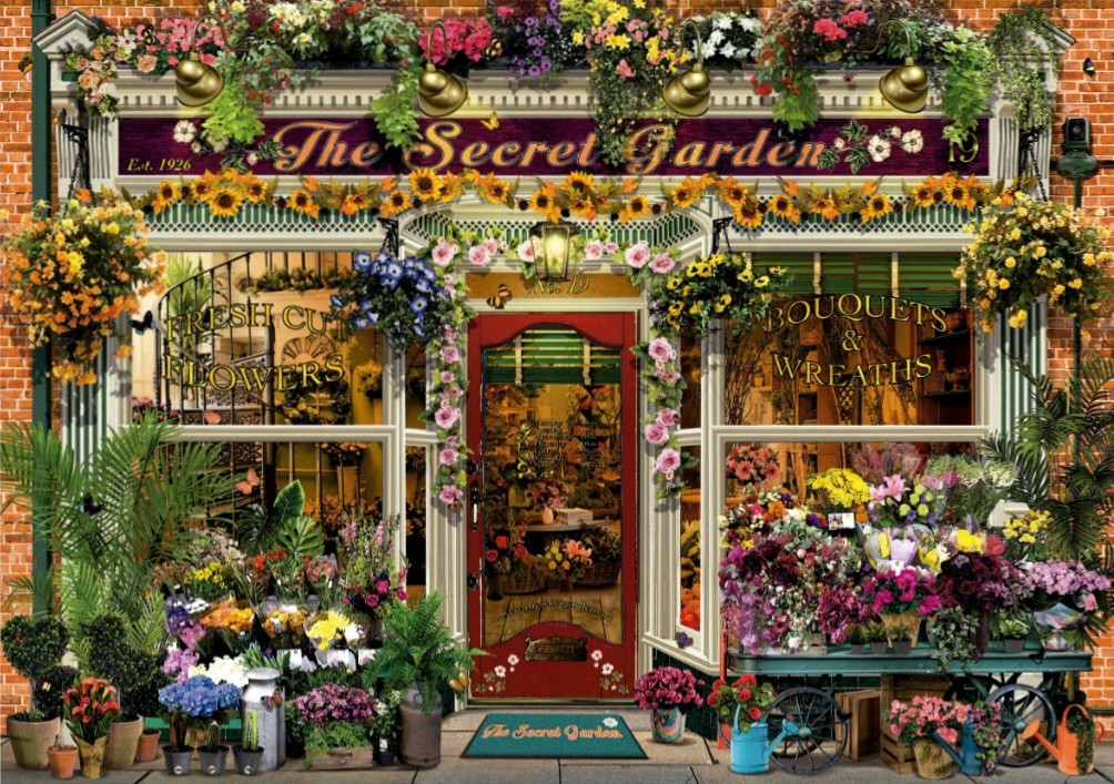 A charming, flower-filled florist shop storefront with a red door and brick facade.