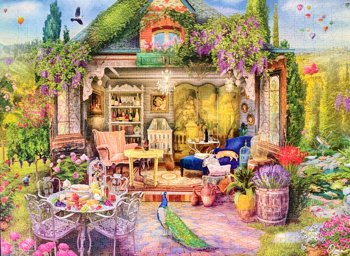 A whimsical cottage garden scene with a peacock, outdoor dining, and a cozy open-air room under a sunlit sky.