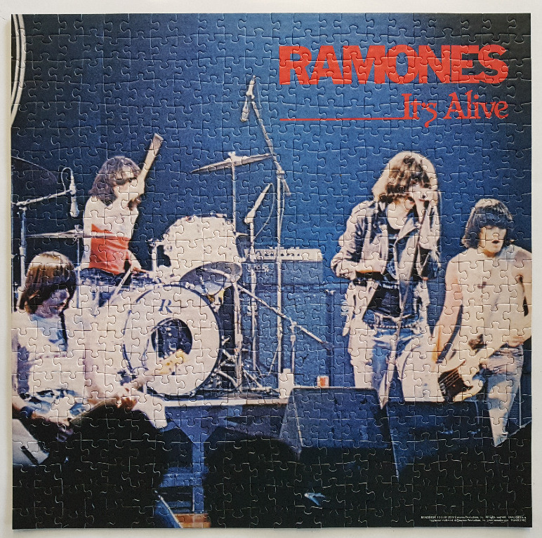 A stage photograph of the punk band Ramones performing during their It