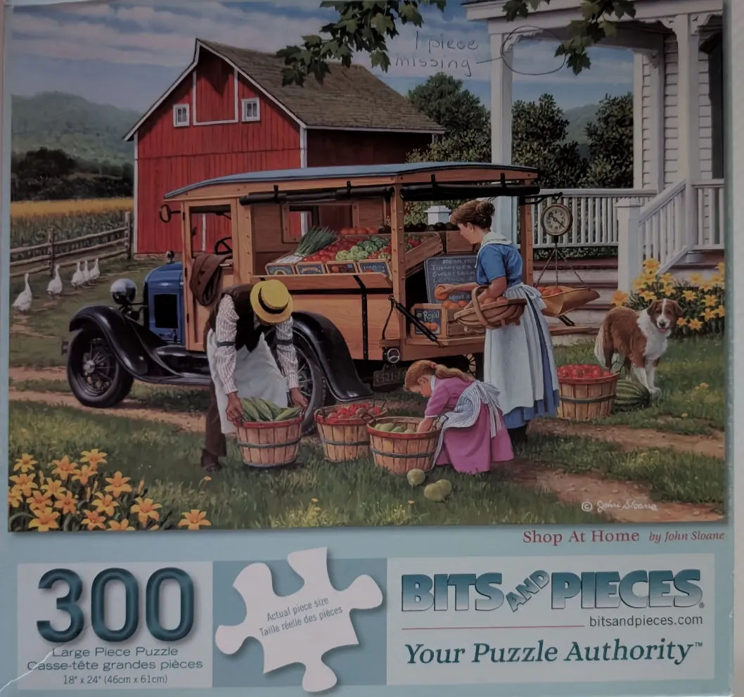 A vintage wooden truck serves as a produce stand in front of a red barn and farmhouse with a family and dog.